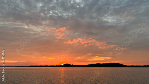 Beautiful sunset with orange sky on the tropical island