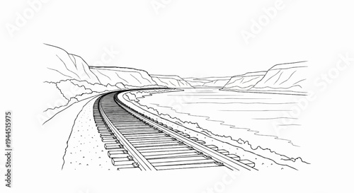 Rail tracks curve beside a calm river through a rugged canyon landscape