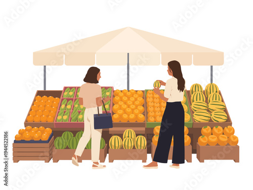 Two women select fresh melons and citrus fruit from a vibrant outdoor market.