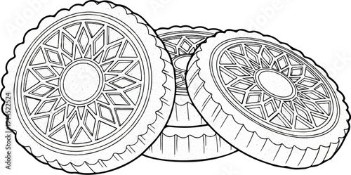 Three intricately patterned round cookies with scalloped edges arranged closely