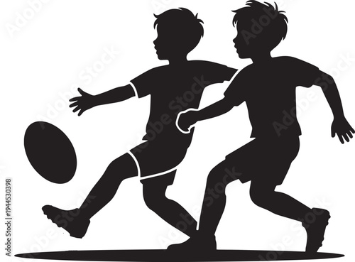 Two children kicking rugby ball during game, dynamic action, focus on movement and sport, silhouettes playing outdoors, energetic pursuit of ball, teamwork and friendship in play