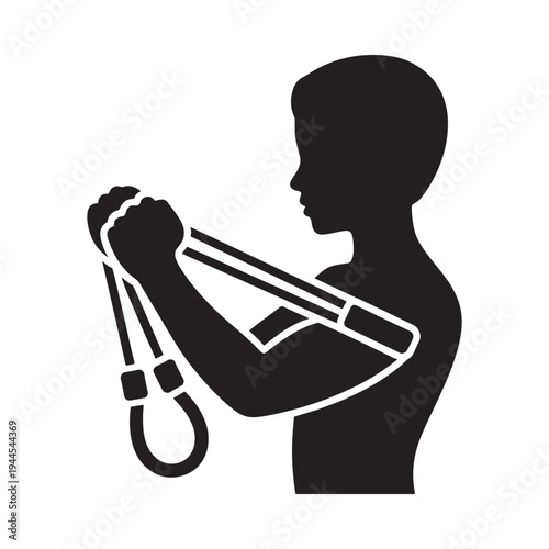 Silhouette of a boy preparing to launch a projectile with a slingshot