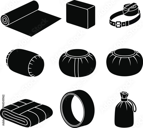 Collection of black yoga and fitness accessories displayed in a minimalist style