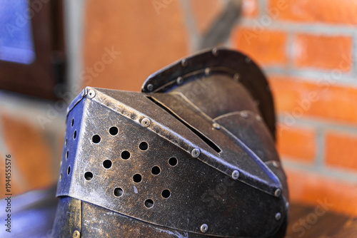 Фотография A helmet with holes in it sits on a table