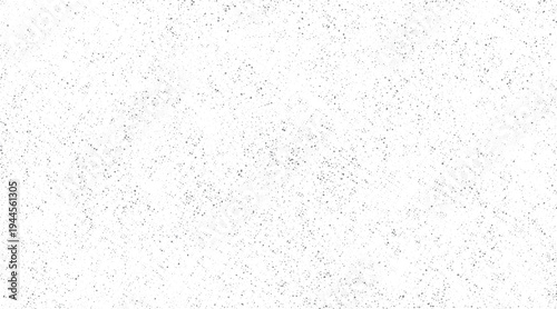 White background with scattered small grey dots and irregular shapes speckle