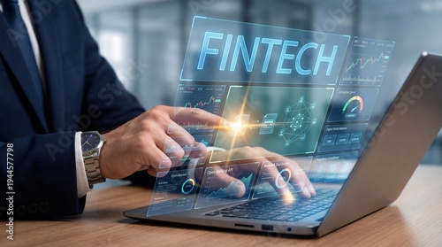A person is working on a laptop in an office. They are exploring fintech graphics and data on the screen. The focus is on technology and finance in a modern environment