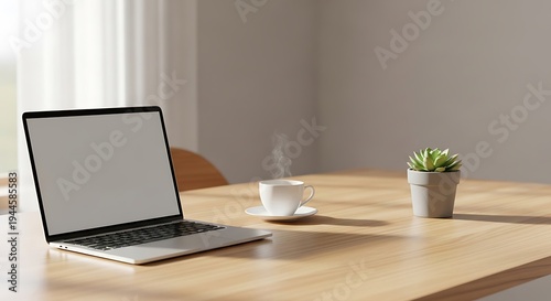 Laptop on a wooden desk with a cup of coffee and a potted plant