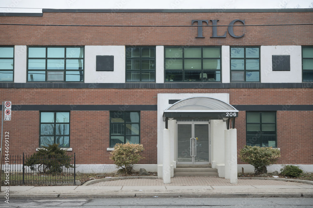Fototapeta premium exterior building facade and sign of TLC The Laser Centre, a specialized vision correction clinic and corporate office located at 206 Laird Drive (Suite 100) in Leaside, Toronto