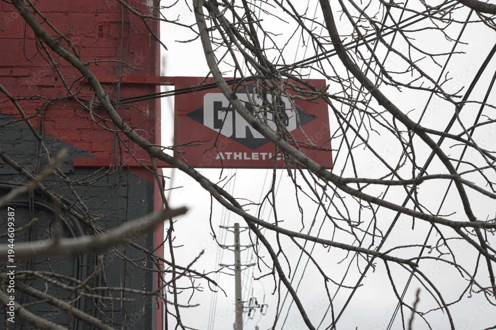 Fototapeta premium wall mounted projecting sign outside GRIT Athletics Toronto Inc, 53 Laird Dr, East York, Toronto