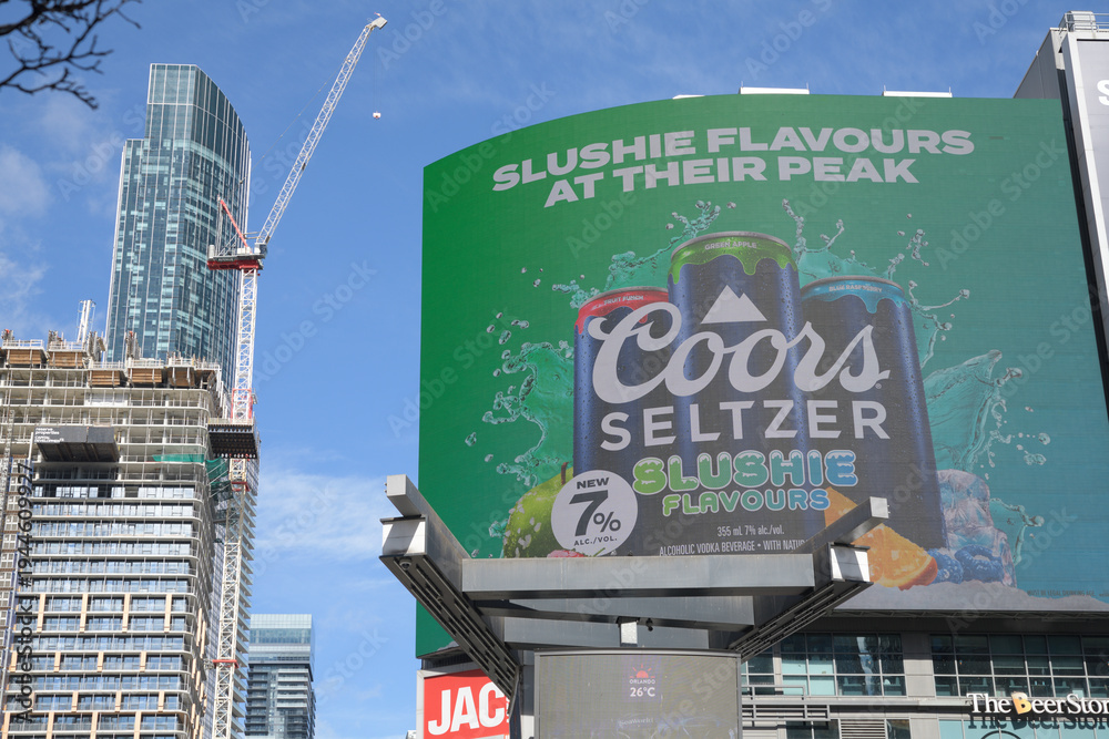 Fototapeta premium digital billboard advertising for Coors Seltzer Slushie Flavours, on the exterior of The Tenor, facing Sankofa Square, Toronto