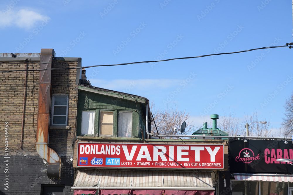 Naklejka premium exterior building and sign outside Donlands Variety, a convenience store, located at 4 Donlands Av, Toronto
