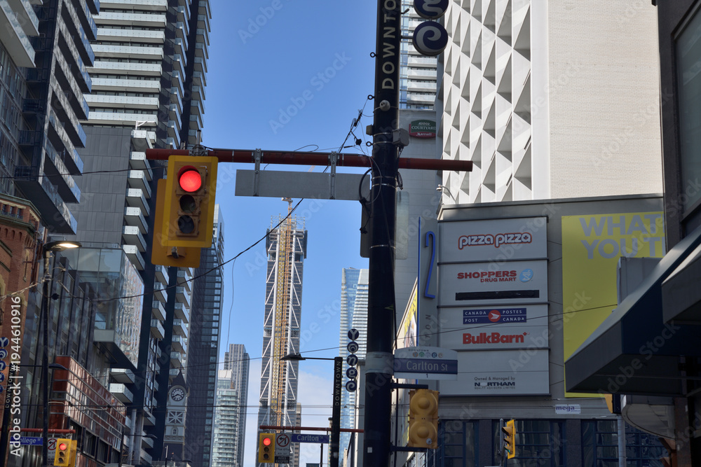 Naklejka premium looking north on Yonge St east side at Carlton St incl business listings (Courtyard Marriott south tower retail shops), Toronto