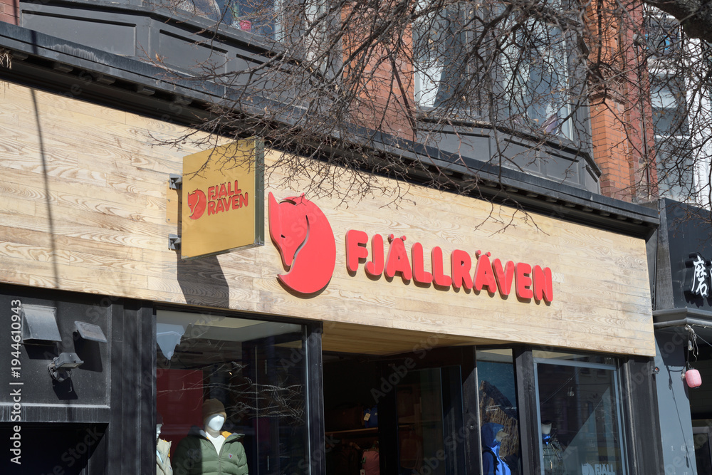 Fototapeta premium exterior building facade and sign of Fjällräven Brand Store, an outdoor clothing and equipment shop, 356 Queen St W, Toronto