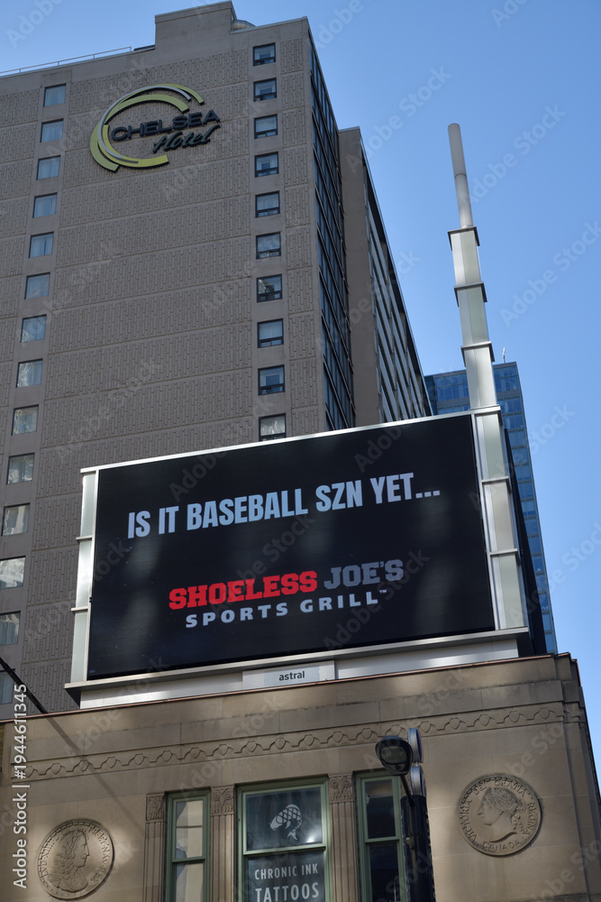 Fototapeta premium rooftop billboard ad for Shoeless Joe's Sports & Grill above heritage property at 380 Yonge St (and above Chelsea Hotel sign), Toronto