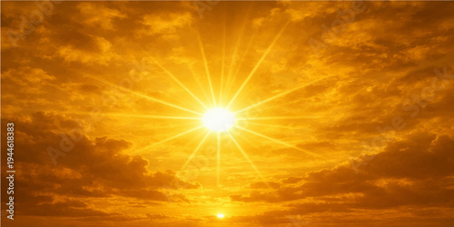 A beautiful summer sunrise illuminates the bright orange sky with golden sunlight filtering through a soft nature cloudscape for a serene atmosphere