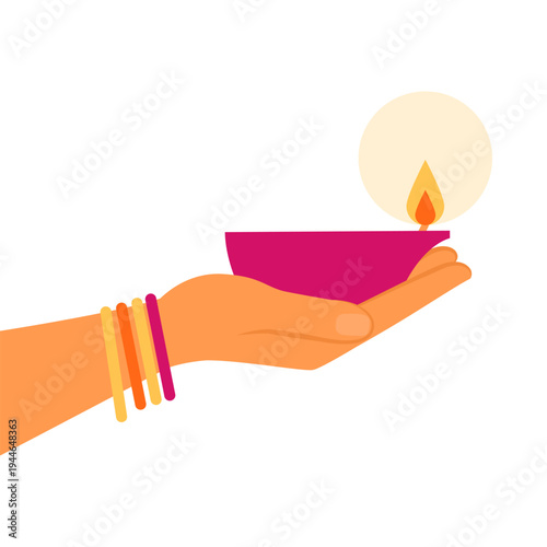 Diwali celebration: hand holding a Diya lamp