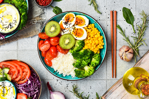Bowl of healthy and nutritious food. Diet concept. On a gray textured background.