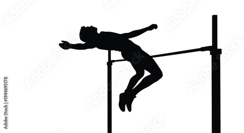 Athlete mid air during a high jump competition dramatic silhouette