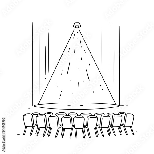 Spotlight Shining on Empty Chairs in Theater
