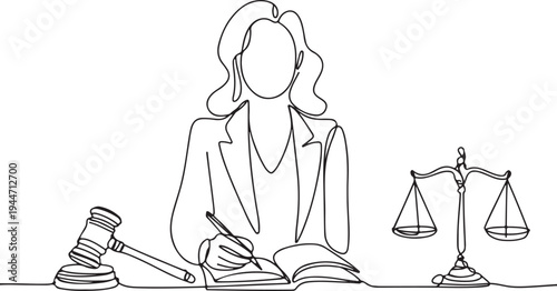 Lawyer writing in book with gavel and scales of justice