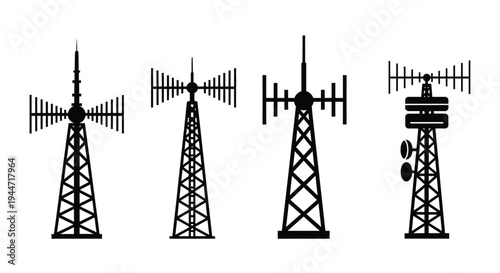 Four communication towers depicted in a stark black silhouette