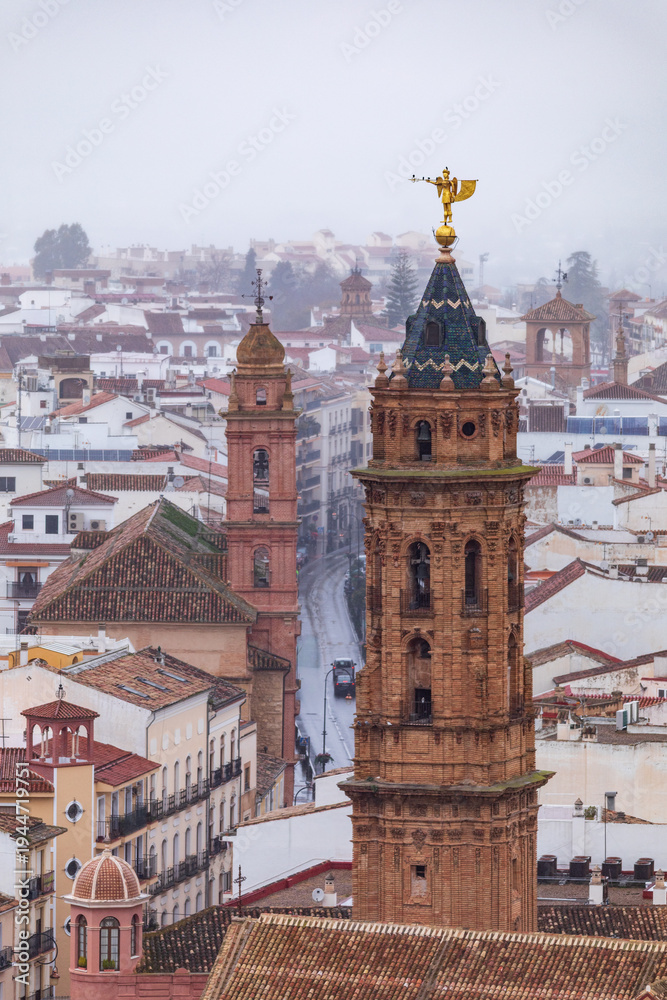 Fototapeta premium Detail of the tower of the parish church of San Sebastián in Antequera, Malaga, Andalusia, Spain