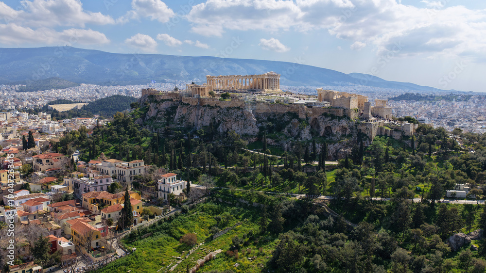 Fototapeta premium Aerial drone photo above Acropolis hill and the Parthenon featuring Propylaea and porch of the Caryatids, Athens historic centre, Attica, Greece
