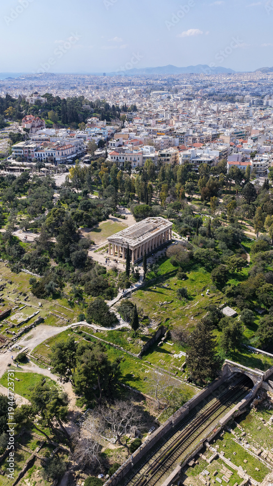 Fototapeta premium Aerial drone photo of iconic Temple of Hephaestus in Ancient Agora of Athens historic centre built below Acropolis hill , Attica, Greece