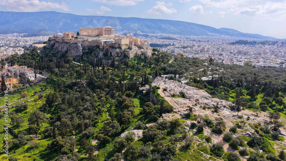 Fototapeta premium Aerial drone portrait photo of iconic Areopagus hill with great views to Acropolis and The Parthenon, Athens historic centre, Atttica, Greece