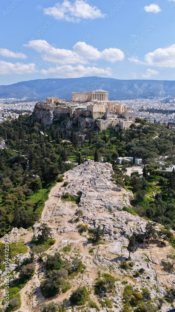 Obraz premium Aerial drone portrait photo of iconic Areopagus hill with great views to Acropolis and The Parthenon, Athens historic centre, Atttica, Greece