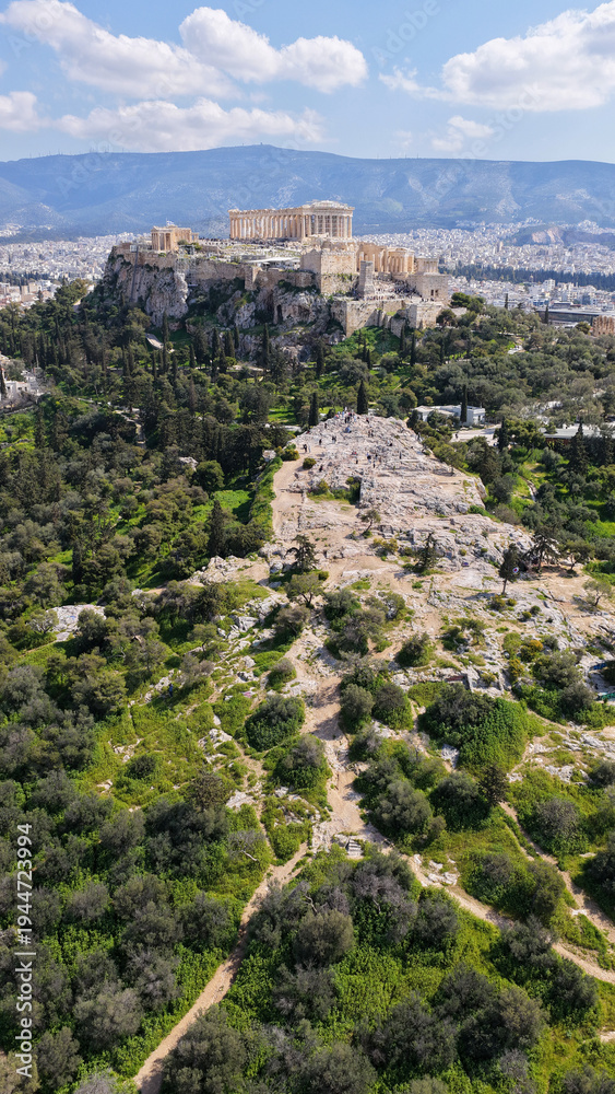Obraz premium Aerial drone portrait photo of iconic Areopagus hill with great views to Acropolis and The Parthenon, Athens historic centre, Atttica, Greece