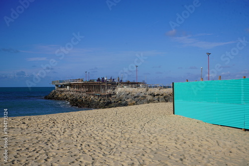 Construction work on a new pier on Iracema beach, with numerous vendor stalls and other amenities for beachgoers. Fortaleza - Ceará, Brazil.