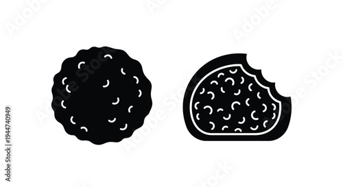 Two chocolate cookies one bitten presented as a dark silhouette