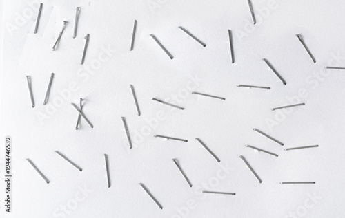 Staples pushed into a paper, metal office staple needles