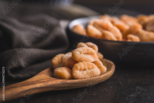 Obraz na płótnie Rustic tomato Gnocchi in spoon Ready to Cook Comforting Italian Pasta Dish