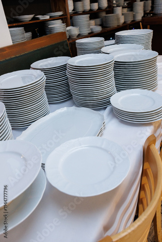 clean white plates and glasses on table