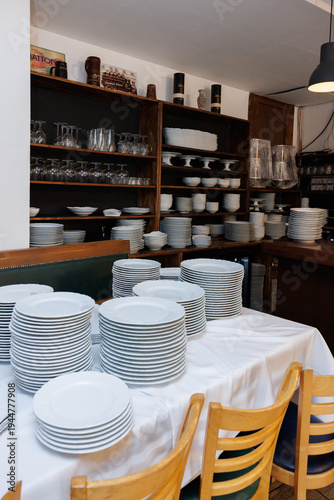 clean white plates and glasses on table