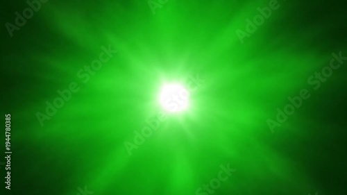 Bright green light beam in dark background with lens flare effect for visual design