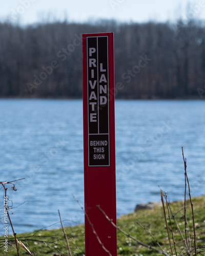 Canvas-taulu "Private land" sign marking property on the border of a public park