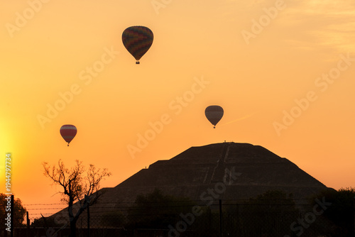 Hot Air Balloons Over Teotihuacan Pyramid of the Sun at Sunrise, Mexico Travel Landmark