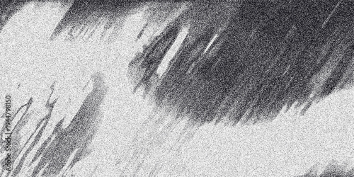 Abstract monochrome textured background with diagonal streaks of dark gray and black particles creating a sense of motion and atmospheric effect