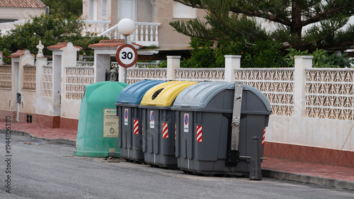 Fotografía Recycling and waste containers on residential street for sorting