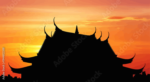 Traditional Thai temple silhouette against a vibrant sunset sky.