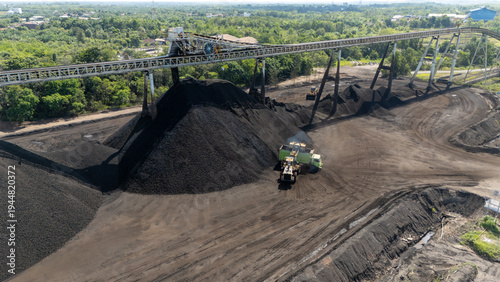 фотографія Drone footage from a coal mining site in South Kalimantan shows trucks and heavy