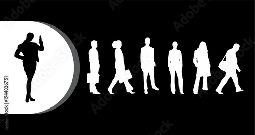 A confident businesswoman standing out from a group of people walking in the same direction