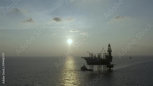 Aerial view of offshore jack up rig and offshore platform for oil and gas exploration and production. 
