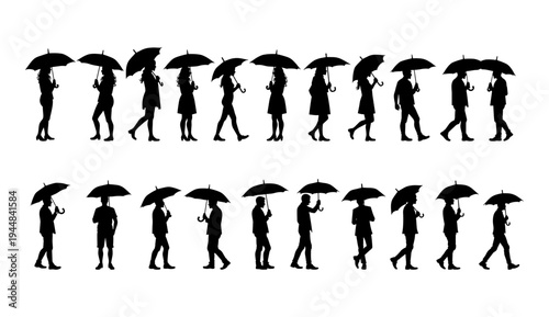 A group of people walking with umbrellas in a rainy city street