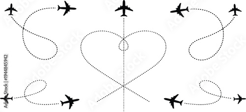 Airplanes fly in heart shape formation with trails in the sky