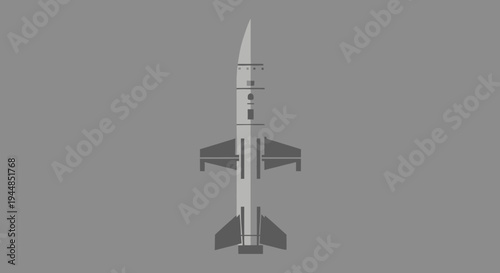 A stylized grey rocket or missile with multiple fins and a pointed nose, depicted vertically against a solid grey background, likely a 3D render or illustration.