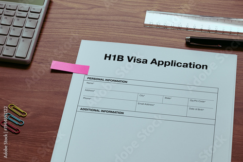 H1B Visa Application: Realistic mock-up mock placed on  with ruler, calculator, sticky note. Contributor-created fictional business document for illustrative purposes.